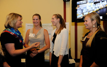 U.S. Rep. Lummis (far left) discusses solar energy with students from Snow College in Utah.